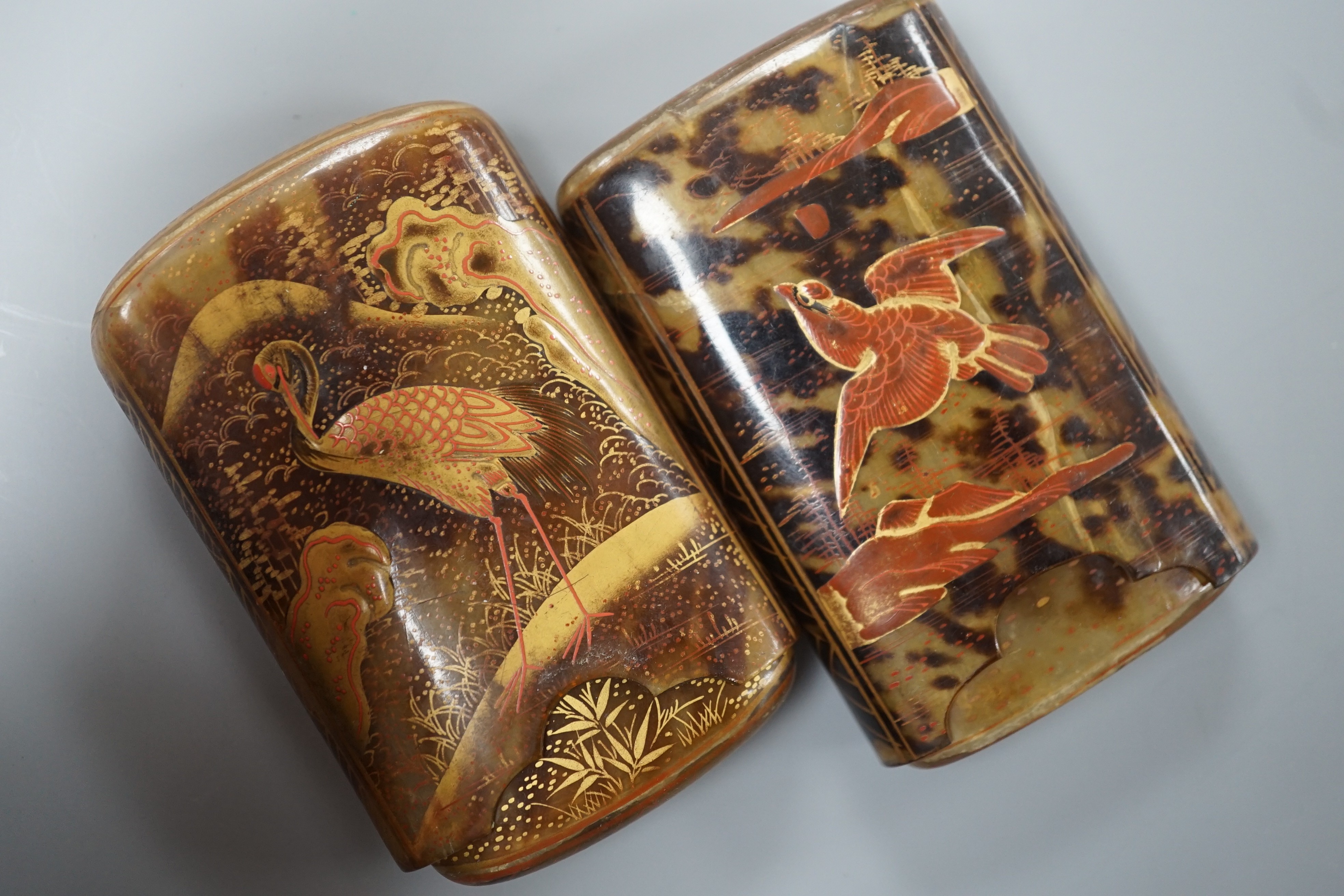 Two Japanese gilt lacquered tortoiseshell cigarette cases, 8 cm